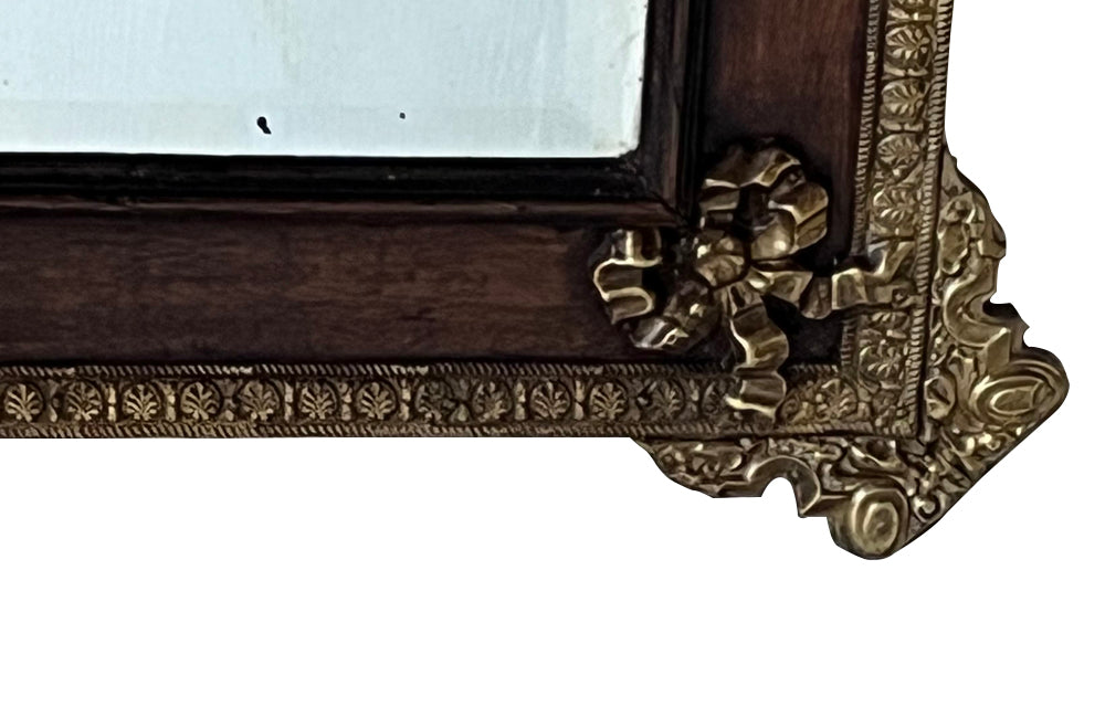 Antique mirror 19th Century French. With brass and glass floral ornamented pediment.