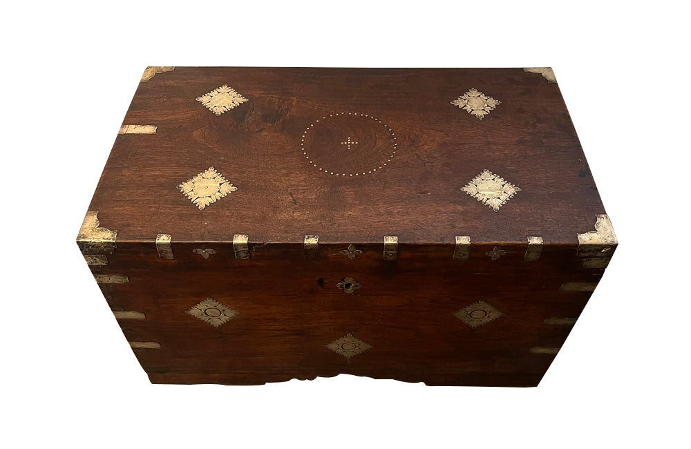 19th Century Anglo-Indian teak lidded trunk with brass ornamentation.