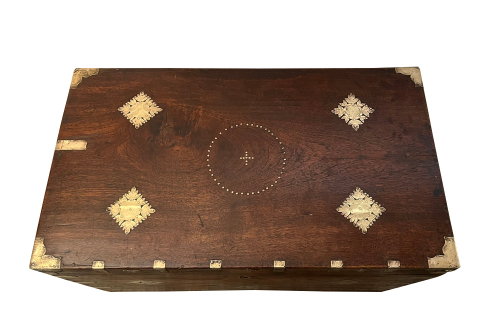 19th Century Anglo-Indian teak lidded trunk with brass ornamentation.