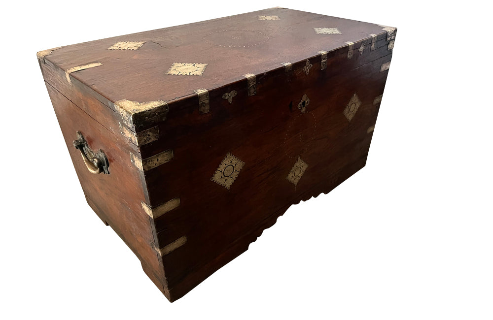19th Century Anglo-Indian teak lidded trunk with brass ornamentation.