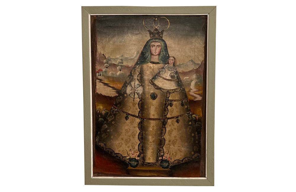 Charming 19th Century Cusco School&nbsp;oil of canvas painting of a Madonna and child standing with two vases of flowers at her feet.
