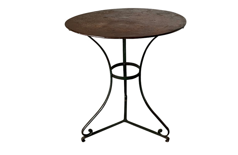 French iron round garden table with old green paint to base circa 1900