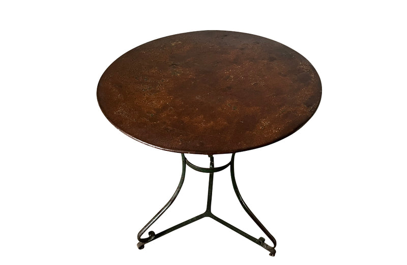 French iron round garden table with old green paint to base circa 1900