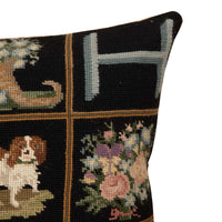 A finely worked 19th Century French needlepoint monogram pillow with King Charles spaniel motif.