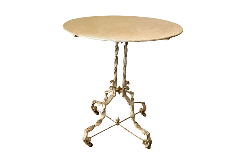 Antique iron table French orangery table on twisted iron base with feet terminating on casters. French Antique Furniture.