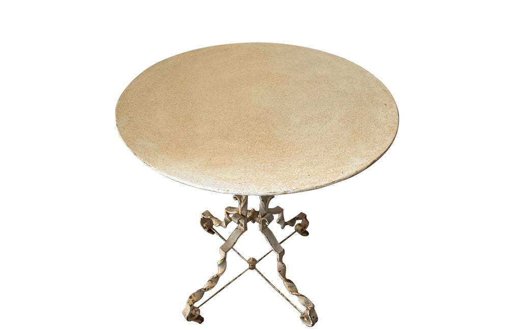 Antique iron table French orangery table on twisted iron base with feet terminating on casters. French Antique Furniture.