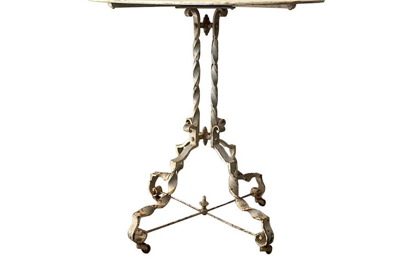 Antique iron table French orangery table on twisted iron base with feet terminating on casters. French Antique Furniture.
