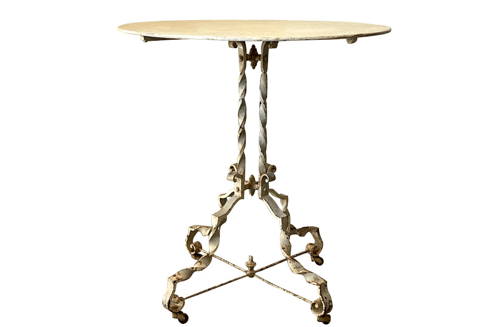 Antique iron table French orangery table on twisted iron base with feet terminating on casters. French Antique Furniture.