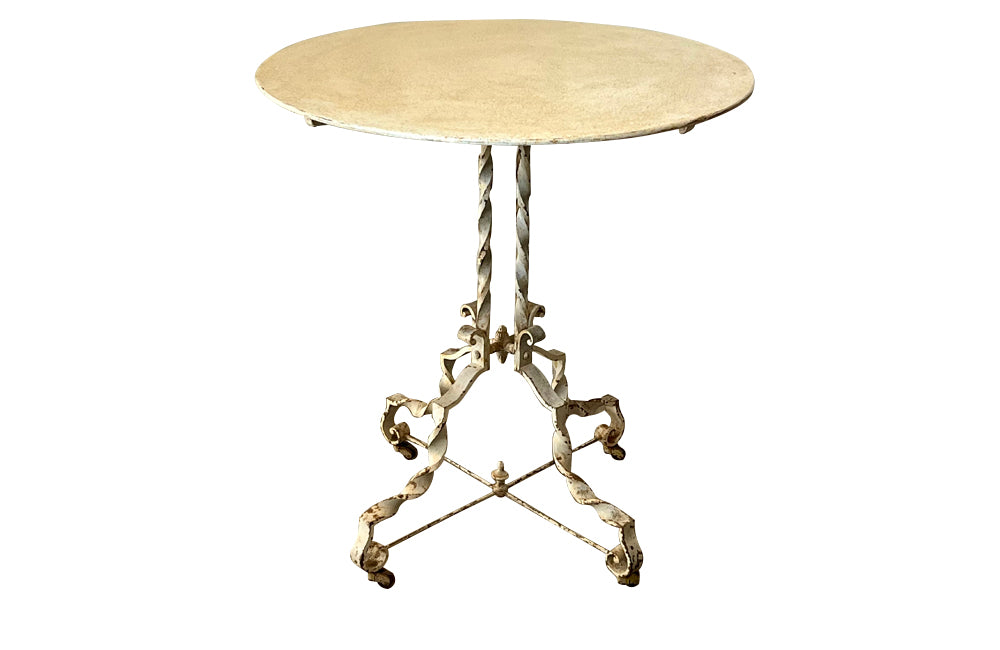 Antique iron table French orangery table on twisted iron base with feet terminating on casters. French Antique Furniture.
