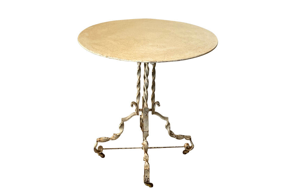 Antique iron table French orangery table on twisted iron base with feet terminating on casters. French Antique Furniture.