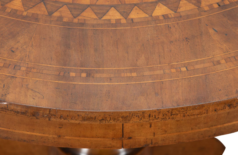 Elegant 19th century Italian walnut parquetry centre table on decorative tripod base.