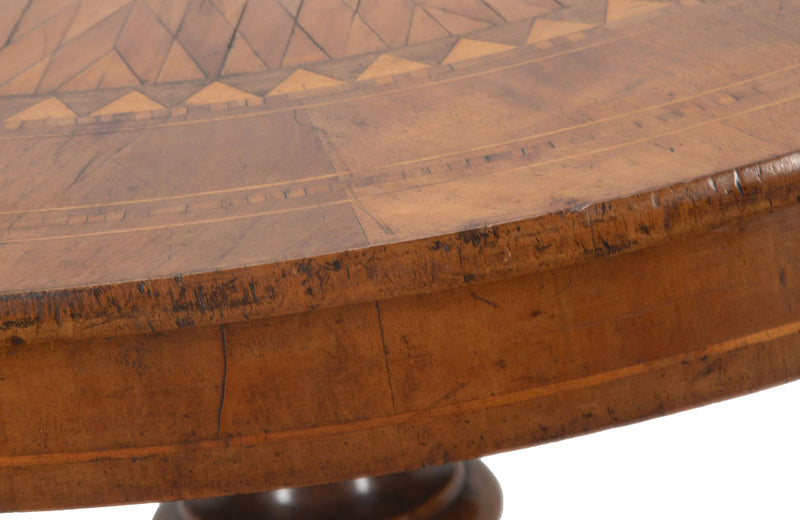 Elegant 19th century Italian walnut parquetry centre table on decorative tripod base.