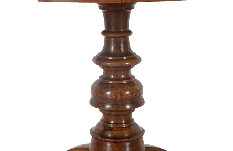 Elegant 19th century Italian walnut parquetry centre table on decorative tripod base.