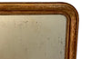 Antique mirror French Louis Philippe giltwood 19th Century with beaded inner surround and Neo-Classical foliate decoration to the frame.