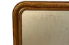 Antique mirror French Louis Philippe giltwood 19th Century with beaded inner surround and Neo-Classical foliate decoration to the frame.