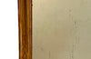 Antique mirror French Louis Philippe giltwood 19th Century with beaded inner surround and Neo-Classical foliate decoration to the frame.