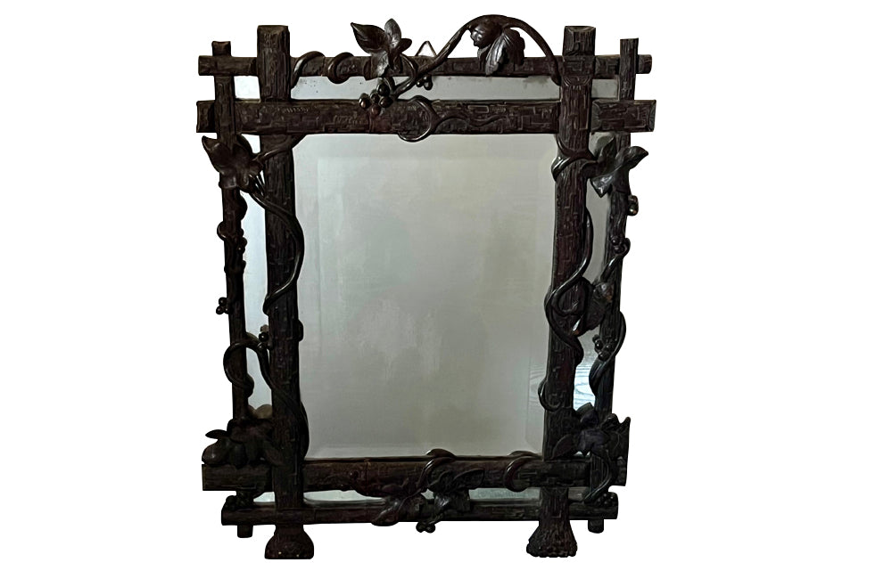 19th century black forest carved frame mirror