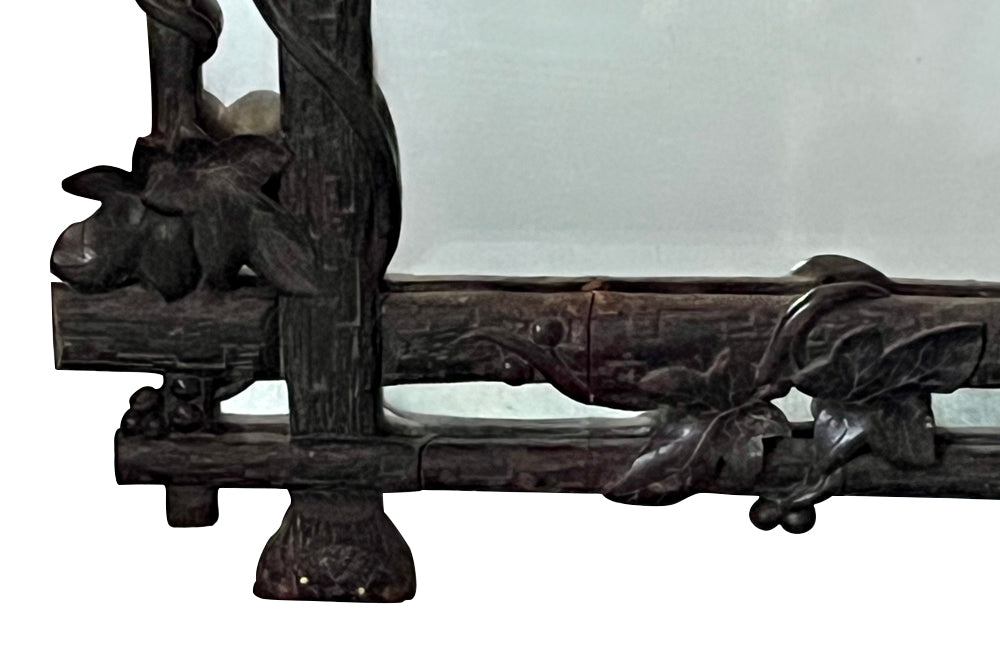 19th century black forest carved frame mirror