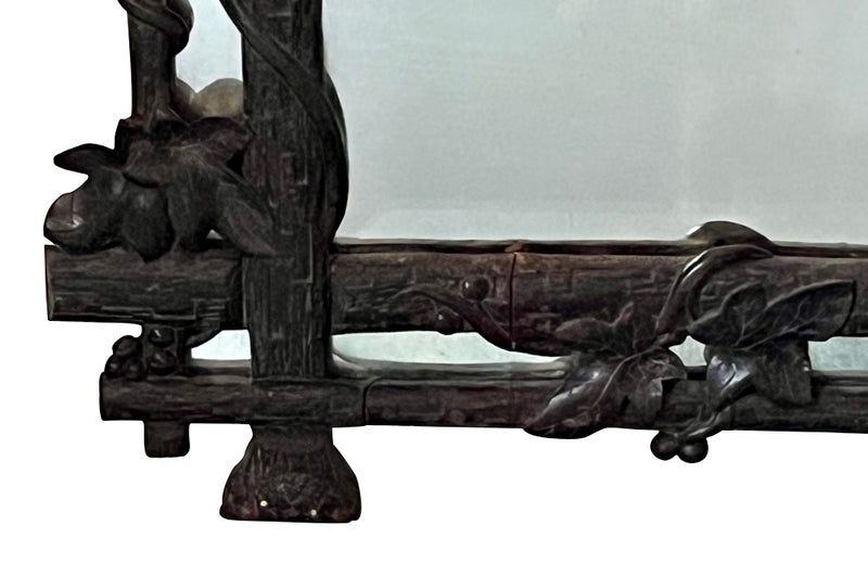 19th century black forest carved frame mirror