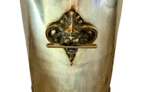 19th century brass umbrella or stick stand with lion head and bar handles and neo-classical style ornamentation.