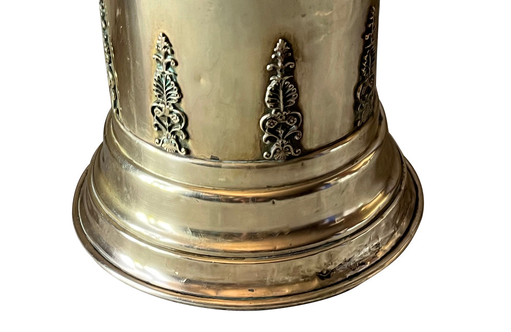 19th century brass umbrella or stick stand with lion head and bar handles and neo-classical style ornamentation.