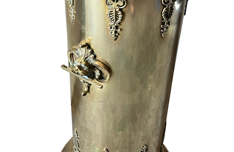 19th century brass umbrella or stick stand with lion head and bar handles and neo-classical style ornamentation.