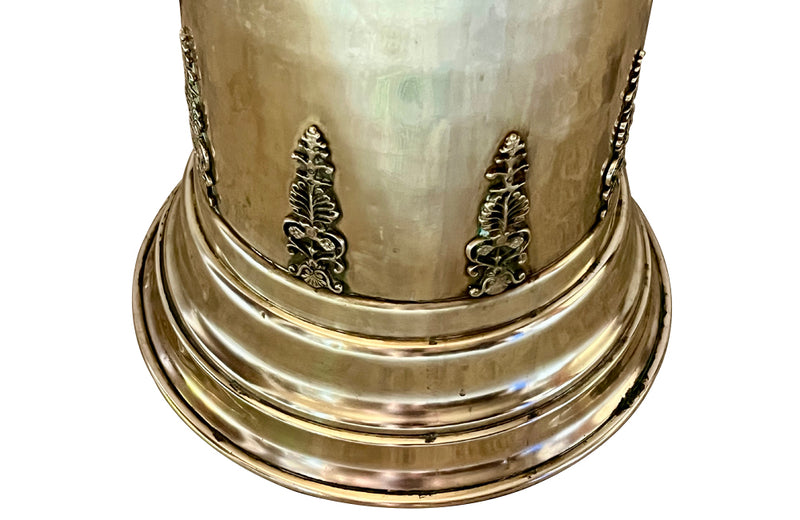 19th century brass umbrella or stick stand with lion head and bar handles and neo-classical style ornamentation.