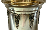 19th century brass umbrella or stick stand with lion head and bar handles and neo-classical style ornamentation.