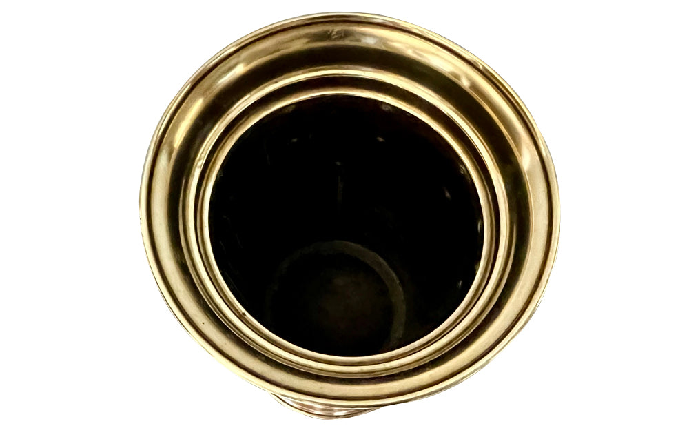 19th century brass umbrella or stick stand with lion head and bar handles and neo-classical style ornamentation.