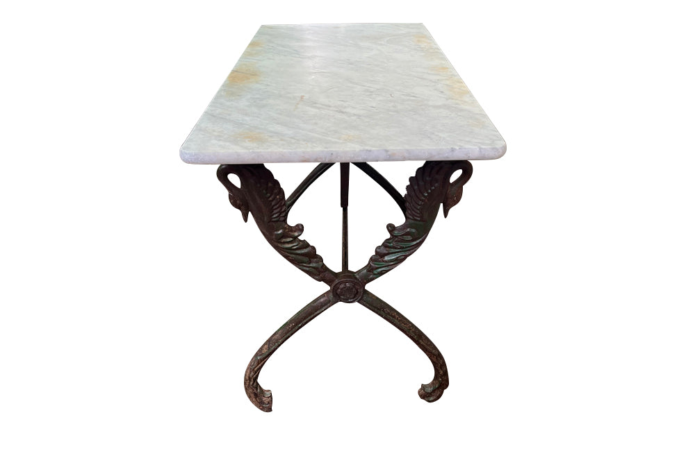 French bistro garden table with stunning cast iron swan design base with lovely green patination to base and old marble top circa 1900