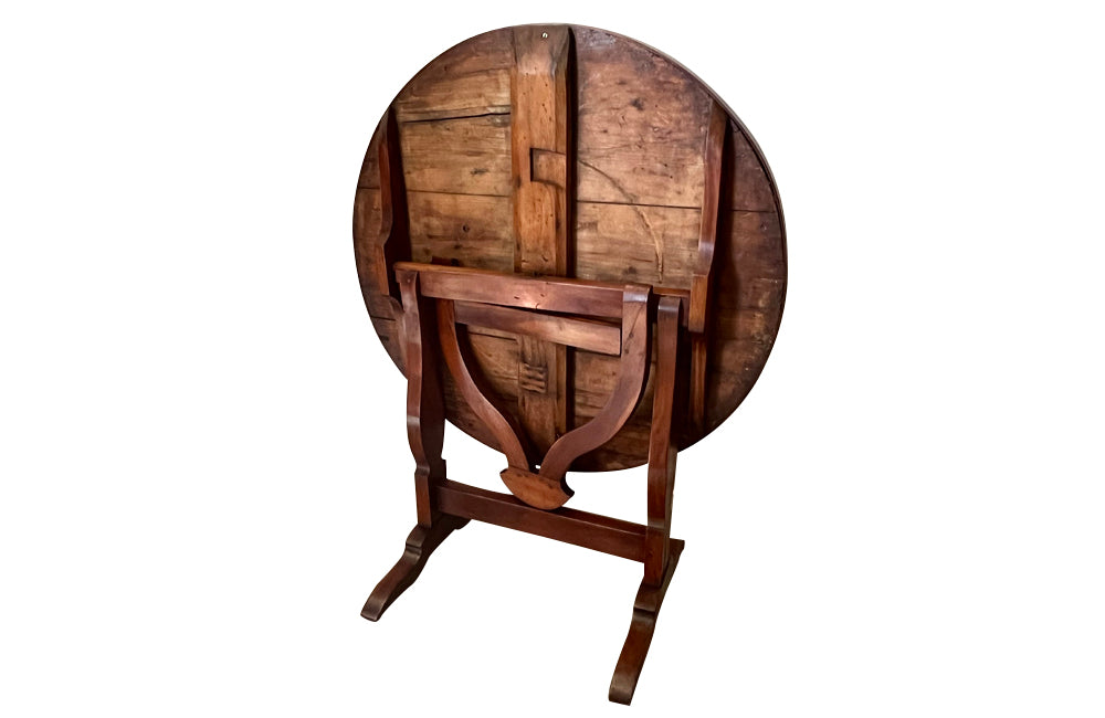 19th century small round cherry wood French vineyard table with turning lyre shaped support to shaped base