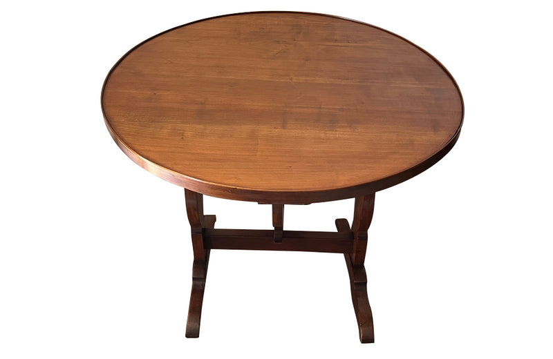 19th century small round cherry wood French vineyard table with turning lyre shaped support to shaped base