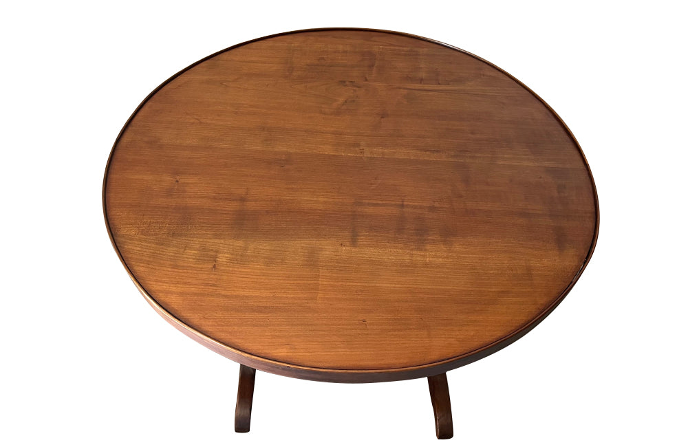 19th century small round cherry wood French vineyard table with turning lyre shaped support to shaped base