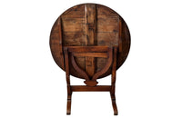 19th century small round cherry wood French vineyard table with turning lyre shaped support to shaped base