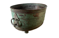 Large 19th century French copper jardiniere with worn verdigris coloured finish on three feet and two ornate swinging handles