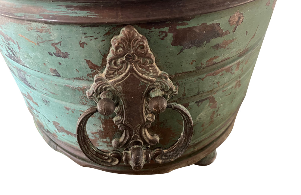 Large 19th century French copper jardiniere with worn verdigris coloured finish on three feet and two ornate swinging handles