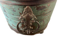 Large 19th century French copper jardiniere with worn verdigris coloured finish on three feet and two ornate swinging handles