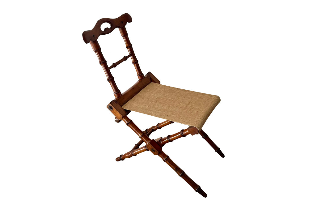 Charming little 19th Century French travel chair in faux bamboo with antique linen seat.