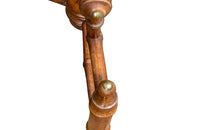 Charming 19th century faux bamboo occasional table with worn tapestry fabric top and decorative fringed surround.