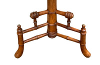 Charming 19th century faux bamboo occasional table with worn tapestry fabric top and decorative fringed surround.