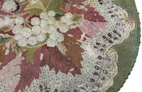 Charming 19th century faux bamboo occasional table with worn tapestry fabric top and decorative fringed surround.