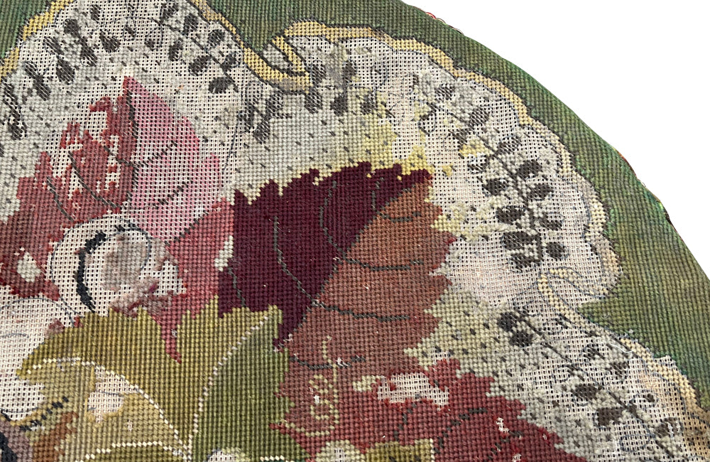 Charming 19th century faux bamboo occasional table with worn tapestry fabric top and decorative fringed surround.