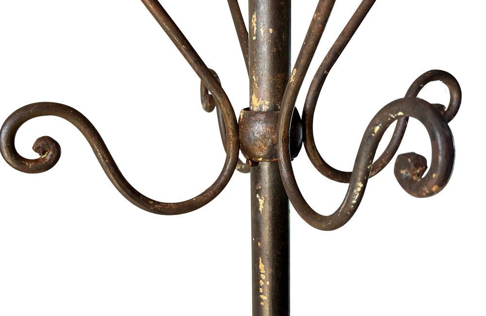 Tall late 19th Century French iron coat and hat rack.