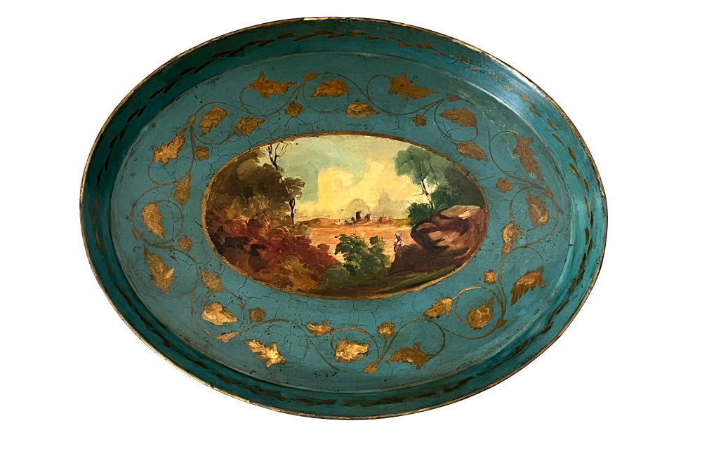 Decorative 19th centiry Italian tole tray with a scenic painting and gold leaf details