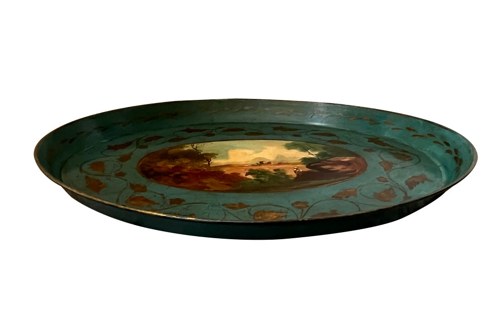 Decorative 19th centiry Italian tole tray with a scenic painting and gold leaf details
