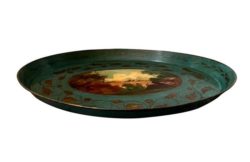 Decorative 19th centiry Italian tole tray with a scenic painting and gold leaf details