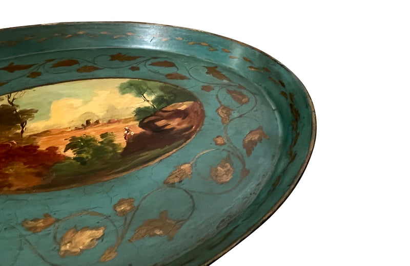 Decorative 19th centiry Italian tole tray with a scenic painting and gold leaf details