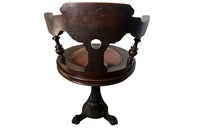 19th Century French carved wooden ships chair with leather seat and heavy cast iron base.