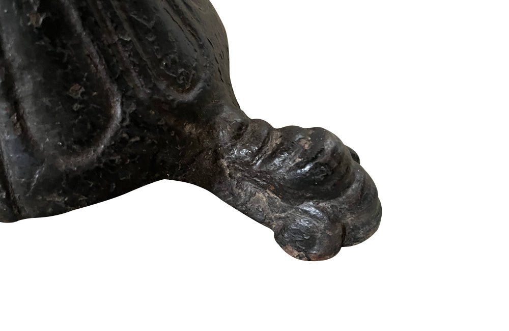 19th Century French carved wooden ships chair with leather seat and heavy cast iron base.