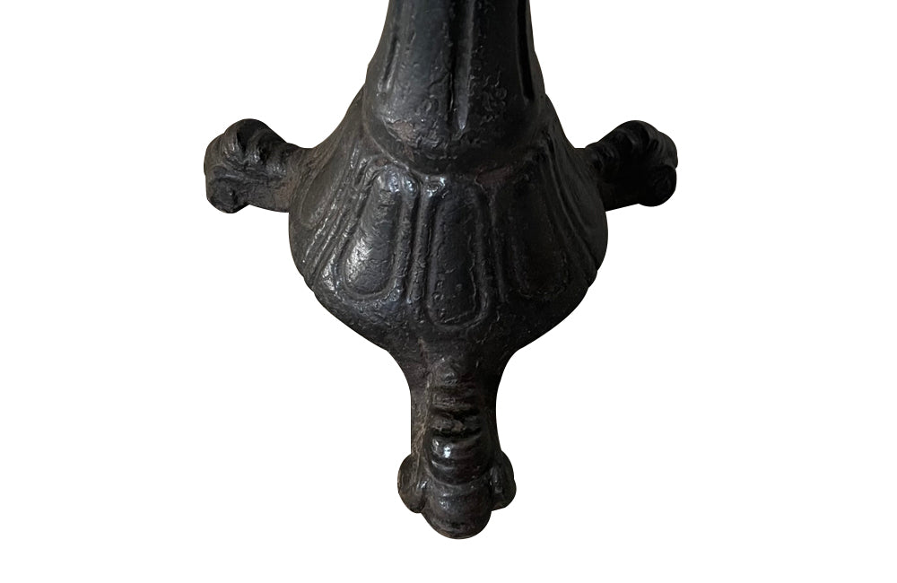 19th Century French carved wooden ships chair with leather seat and heavy cast iron base.